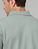 A men's cotton stretch polo shirt in a soft green colour, featuring a classic collar and logo detail.