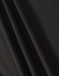 A close-up of black fabric showcasing texture and drape, featuring a subtle weave pattern.