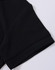A close-up of a black polo shirt sleeve featuring a folded cuff and a subtle branding logo.