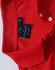 A red polo shirt featuring a collar and buttons, with a brand label on the inner neck area.