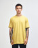 Unisex fine jersey short sleeve t-shirt in vibrant yellow, modelled by a person wearing blue jeans. Features a logo.