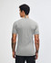 A grey unisex short sleeve t-shirt is displayed from the back, featuring a logo on the neckline.