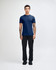 A model wearing a navy unisex fine jersey short sleeve t-shirt and tan wide-leg pants. The t-shirt has a logo.