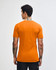 An orange unisex short sleeve t-shirt featuring a logo on the back.