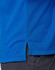 A close-up of a blue polo shirt with a side vent detail, featuring a logo at the chest area.