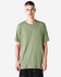 A plain green unisex CVC short sleeve T-shirt displayed on a model, featuring a subtle logo.