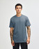 A unisex CVC short sleeve t-shirt in a blue colour, featuring a logo on the front.