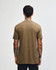 A unisex short sleeve t-shirt in a light brown hue, featuring a simple design and a logo on the back.