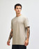 A unisex short sleeve T-shirt in a muted green colour with a simple design and a branding logo.