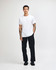 A young man wearing a plain white unisex short sleeve t-shirt and loose blue jeans, standing against a white background.