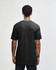 A black unisex CVC short sleeve t-shirt displayed from the back, featuring a simple design and no visible branding.