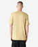 A unisex short sleeve t-shirt in a light beige colour, featuring a plain back and relaxed fit.