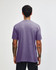 A unisex short sleeve T-shirt in a purple shade, featuring a simple design and a logo on the back.