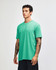 A unisex short sleeve t-shirt in a vibrant mint green colour, featuring a logo on the front.