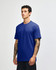 A unisex short sleeve T-shirt in royal blue, featuring a plain design and a logo on the chest.