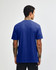 A blue unisex CVC short sleeve t-shirt with a plain back view, featuring a logo.