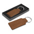 A brown leather key ring with a silver metal attachment, presented in a black gift box.