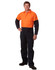 A man stands wearing a two-tone high-visibility cotton drill coverall in orange and navy blue. The coverall features pockets and has a logo.