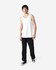 A white tank top displayed on a model wearing black jeans and sneakers, featuring a logo.