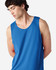 A blue Gildan Heavy Cotton adult tank top displayed on a model. The tank has a round neckline and no visible branding.