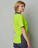 A woman wearing a bright lime green short-sleeved polo shirt with grey accents and a logo.
