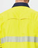 A high-visibility yellow long-sleeve shirt with segmented reflective tape on the back and a navy collar.