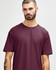 A close-up of a male model wearing a maroon Gildan Softstyle adult T-shirt with a round neckline.