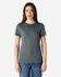 A grey Gildan Softstyle ladies' T-shirt displayed on a model, featuring a classic round neckline and short sleeves.