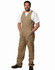 Men's DURA WEAR action back overalls in khaki, featuring multiple pockets and a logo, worn by a man.