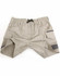 Beige unisex cotton stretch drill work shorts with an elastic waistband and pockets. The shorts have a logo and contrasting details.
