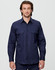 A navy blue cotton drill work shirt featuring two front pockets and a button-up design. It has a logo on the shirt.