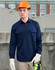 A navy long-sleeve work shirt with a closed front, featuring two chest pockets and worn by a model in a hard hat and gloves.