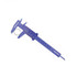 A blue vernier caliper with a metallic ring displayed alongside, featuring a logo.