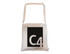 A cream tote bag with long handles featuring a black square design and a logo.