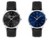A men's dress watch with a black dial and silver hands, featuring a leather strap. Another watch has a blue dial.