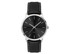 A men's dress watch featuring a black dial and a black leather strap with white stitching. It has a simple silver casing and a logo.
