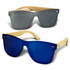 A pair of sunglasses featuring bamboo frames, with one dark grey lens and one blue lens.