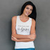 A white women's tank top with a logo, featuring a casual fit and text design.