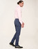 Men's flexi chino pants in navy, styled with a light pink shirt and black shoes, featuring a sleek fit.