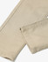 Flexi chino pants in a beige colour, featuring a tailored cut and visible stitching details. Includes a branding logo.
