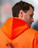 A bright orange water-resistant fleece hoodie with a hood, featuring a logo on the back.