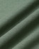 A close-up of folded fabric in a soft, muted green colour, showcasing a smooth texture with subtle ribbing.