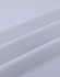A close-up view of white cotton fabric, showcasing its smooth texture and soft folds.