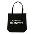 A black tote bag with two handles and a logo featured prominently on the front.