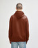 A brown hooded sweatshirt featuring a spacious hood and a relaxed fit, with an unseen logo on the back.