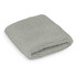 A grey wrist sweat band folded neatly, showcasing a textured fabric with an elastic design. It features a logo branding.