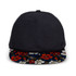 A custom flat peak cap featuring a dark navy body and a floral-patterned peak in vibrant colours. It has a logo.