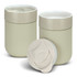 Two light beige ceramic coffee cups with lids, featuring a logo on the surface.