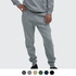 A person wearing grey unisex sweatpants with a relaxed fit, featuring an elastic waistband and cuffed ankles.