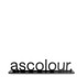 A black acrylic display featuring the word "ascolour" in bold, stylised letters, mounted on a flat base.